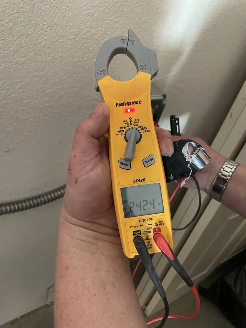 Voltage testing with clamp meter during Whole House Surge Protector in Yorkshire